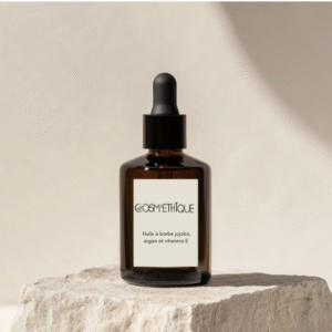 flacon en verre avec pipette sur une pierre de decoration